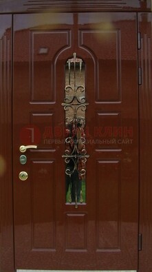 Красивая металлическая дверь со стеклом и ковкой ДСК-33 в Кирове